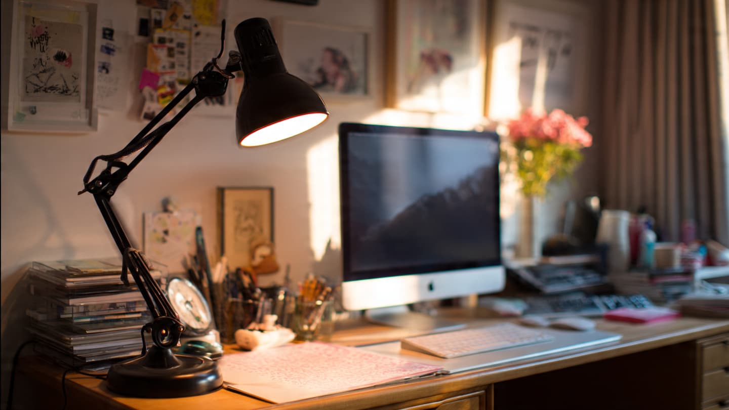 Desk setup showing balanced ambient and task lighting