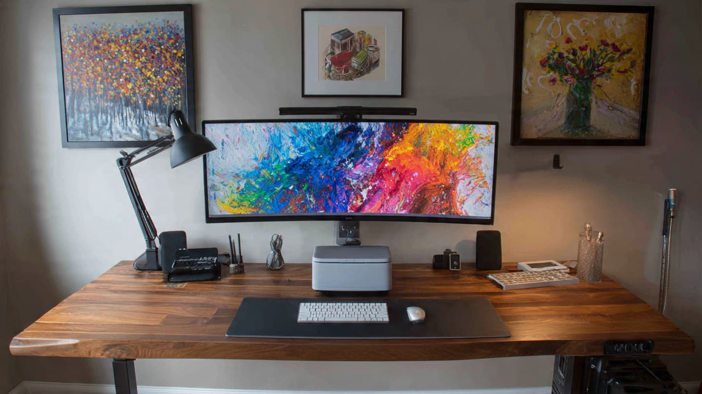 Desk accessories comparison including monitor arms, lamps, and cable management